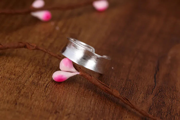 Geometric adjustable opening frosted sterling silver ring on finger