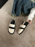 Retro raised sole sandals with ankle-strap buckle in black microfiber