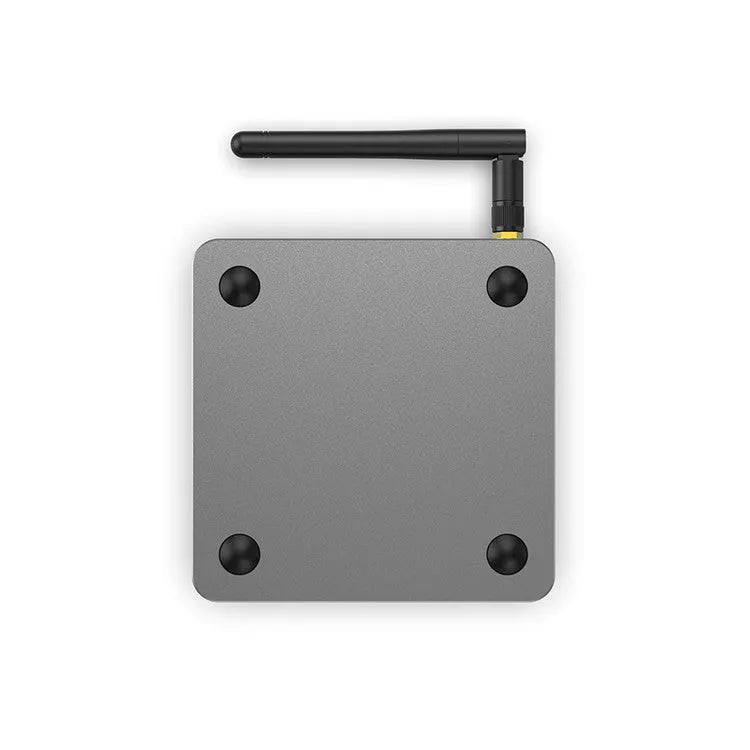 Smart voice set-top box with remote control, HDMI cable, and power adapter on a table