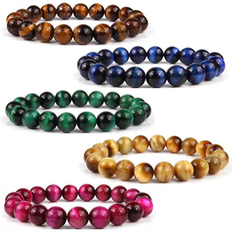 Natural tiger eye crystal bracelet with round beads in dark blue colour, showing tiger eye banding patterns