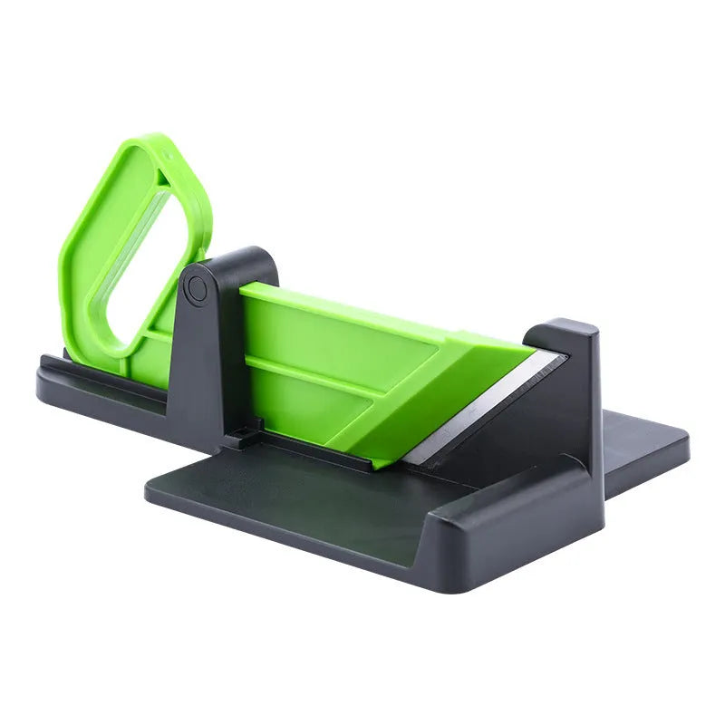 Green vegetable cutter with stainless steel blades for slicing carrots and potatoes