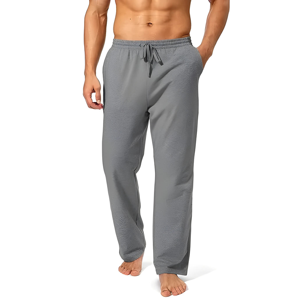 Men's loose-fitting grey casual trousers made from quick-drying polyester fabric.