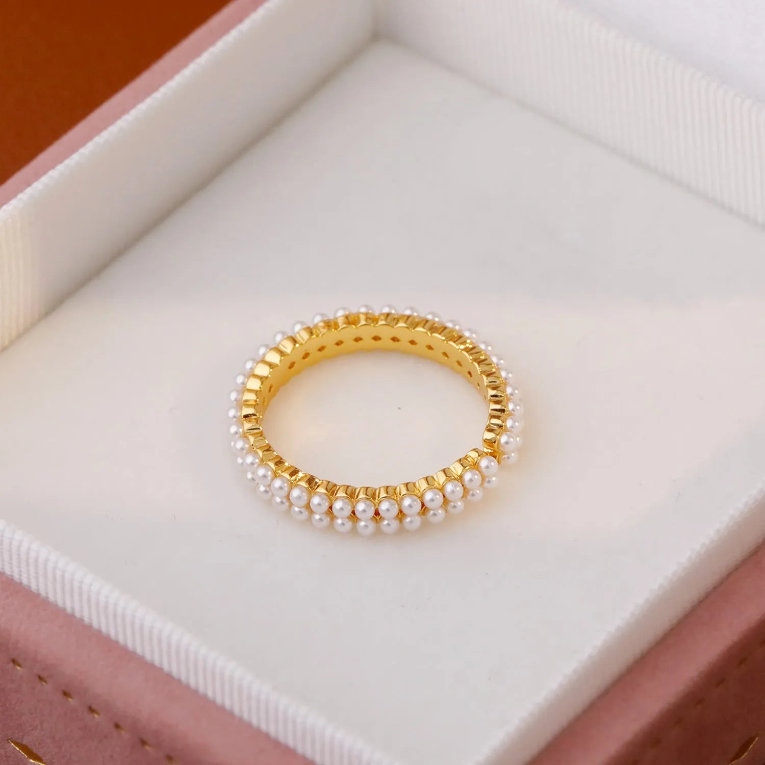 Gold-coloured geometric open-mouth ring with pearl detailing on copper electroplated band