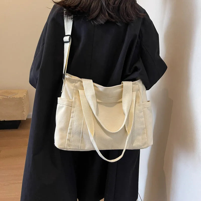 Women's shoulder tote bag in solid colour with sandwich pocket and internal mobile phone compartment for leisure travel