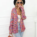 Rainbow striped loose fit knitted cardigan coat on a hanger, rose red with multicolour stripes.