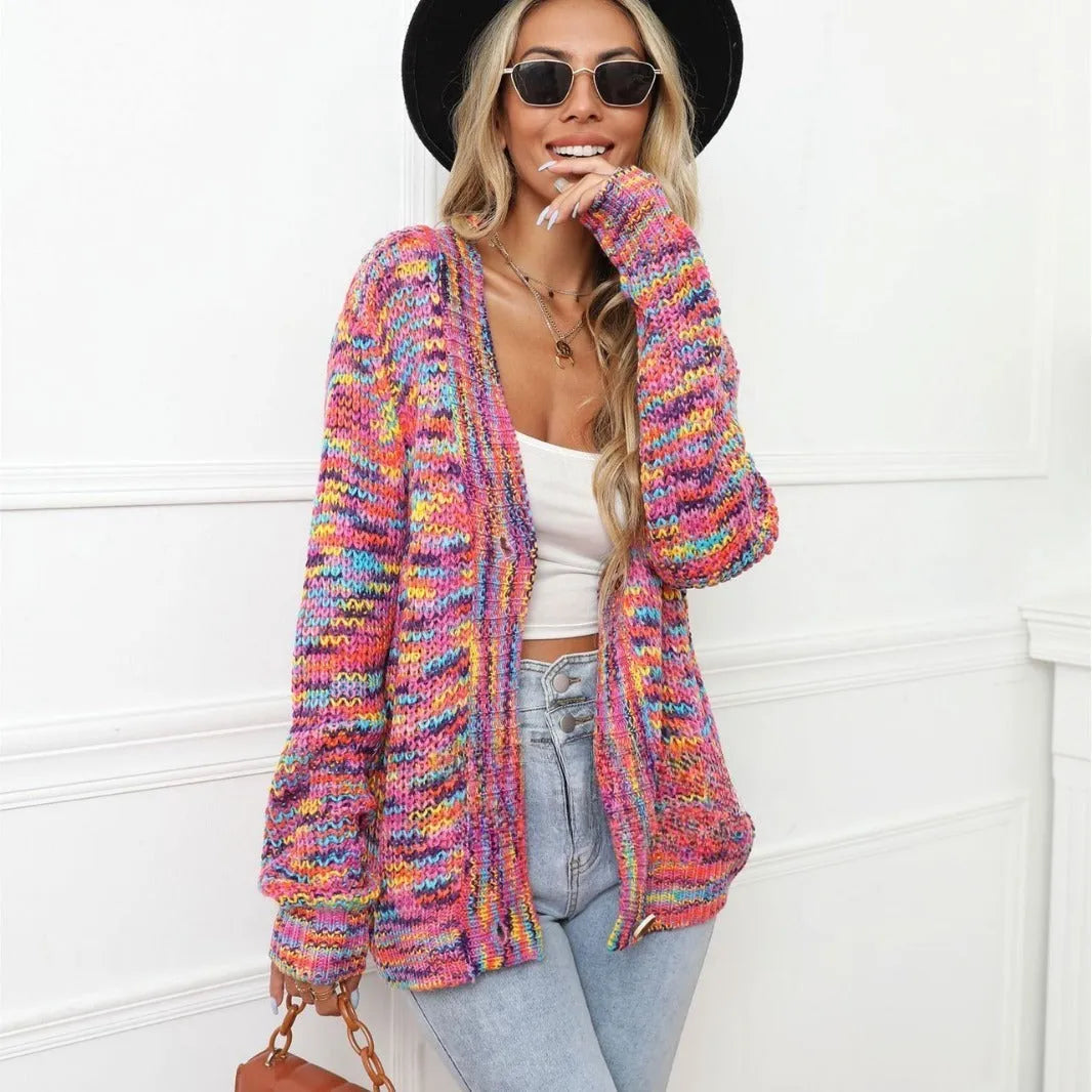 Rainbow striped loose fit knitted cardigan coat on a hanger, rose red with multicolour stripes.