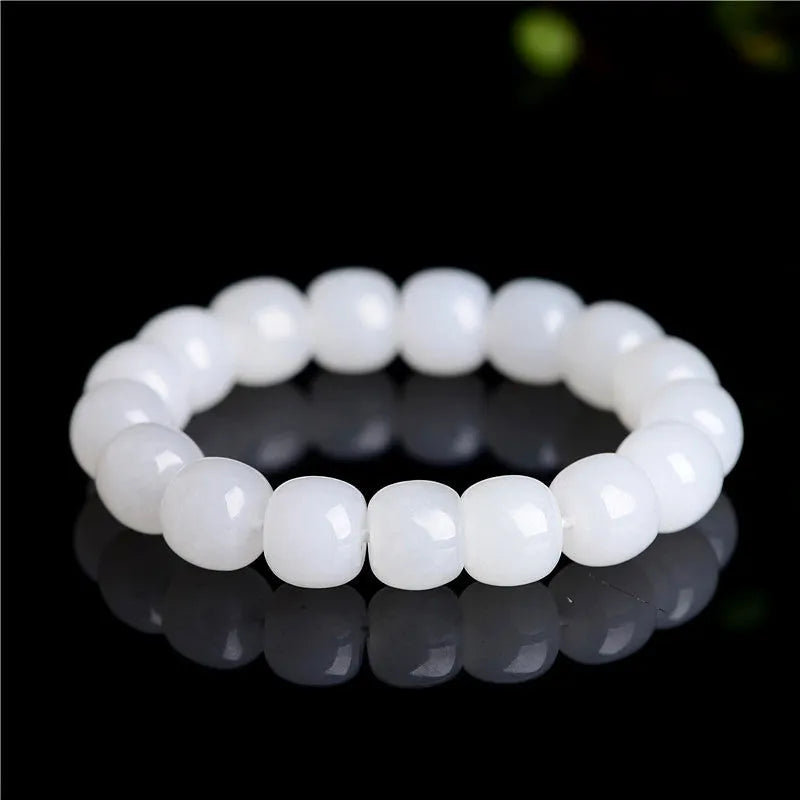White jade barrel beads bracelet on wrist, showing Hetian jade beads in casual unisex design
