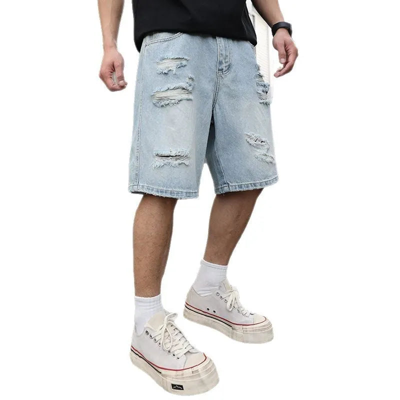 Light blue ripped denim shorts with distressed details and straight leg cut in hip hop streetwear style