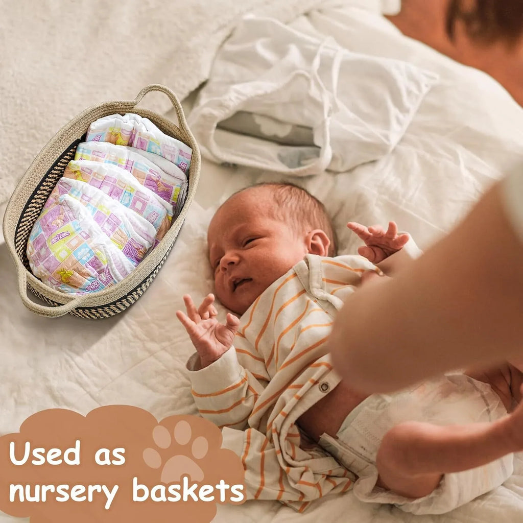 Small woven cotton rope storage basket with wooden handle in light beige, measuring 34x26x15cm, on a shelf with toys
