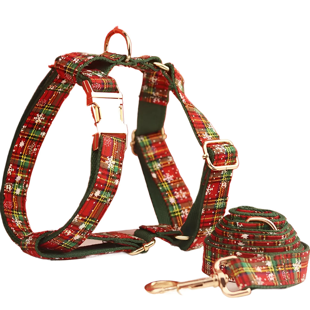 Green snowflake patterned cloth dog collar set with matching vest, leash, and bow for Christmas
