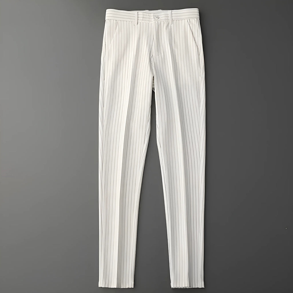 Man wearing loose fit thin striped suit pants in a crop jeans style, available in black or white.