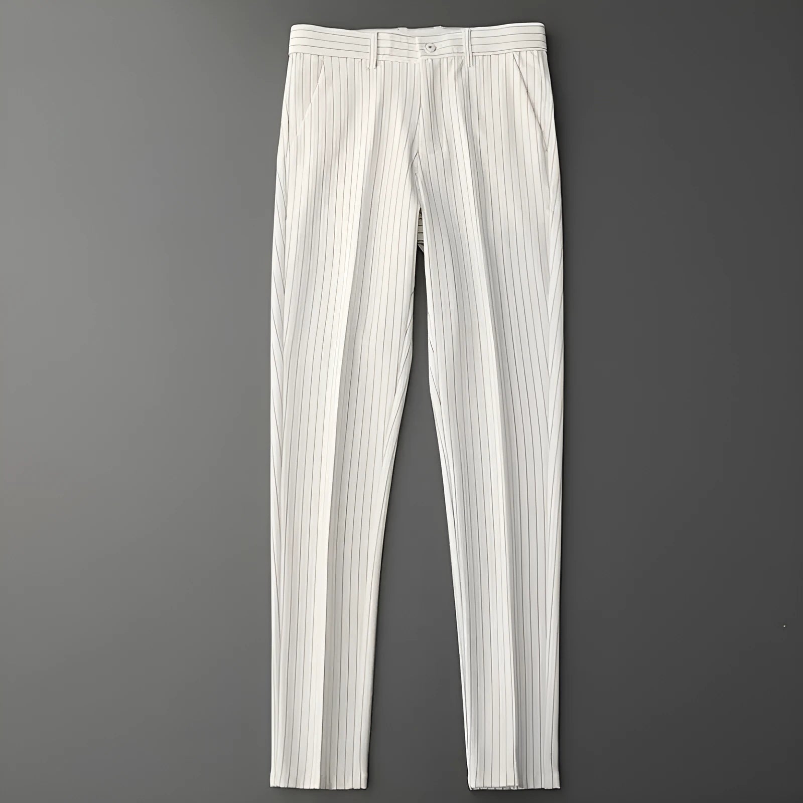 Man wearing loose fit thin striped suit pants in a crop jeans style, available in black or white.