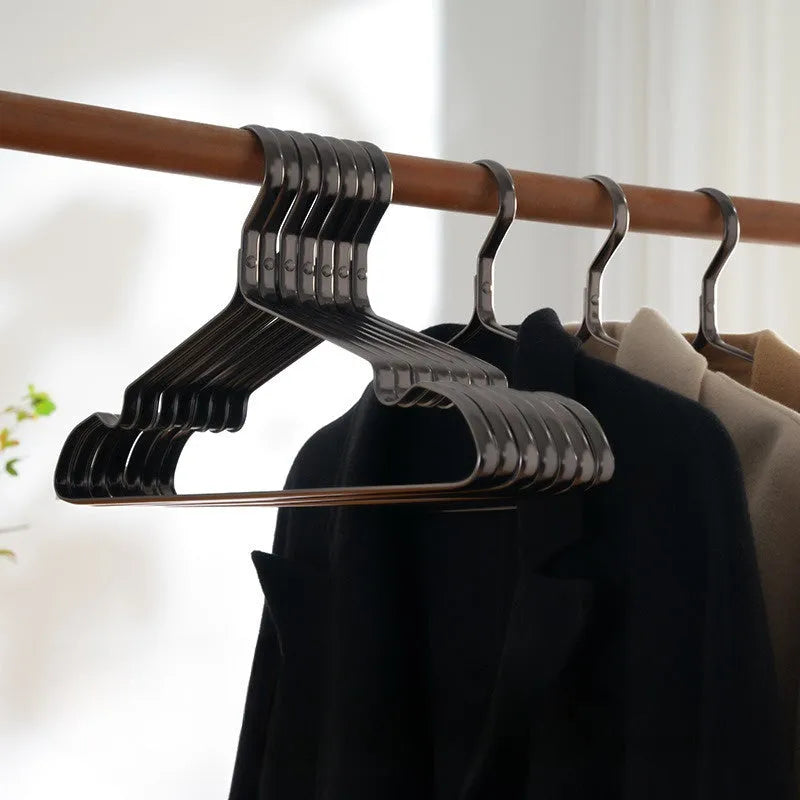 Elegant black modern clothes hanger with non-slip surface for secure garment storage