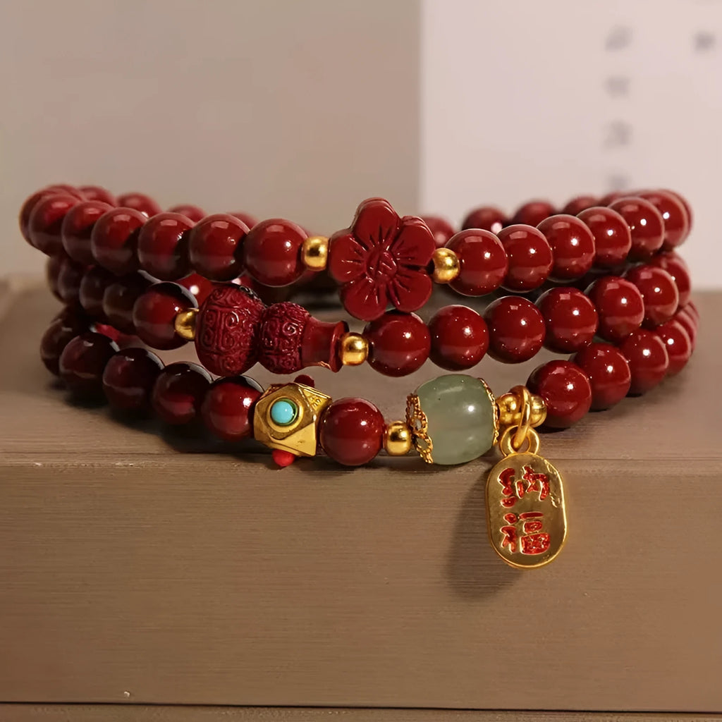 Red cinnabar bracelet with geometric gourd and flower design, 6mm diameter with clasp fastening