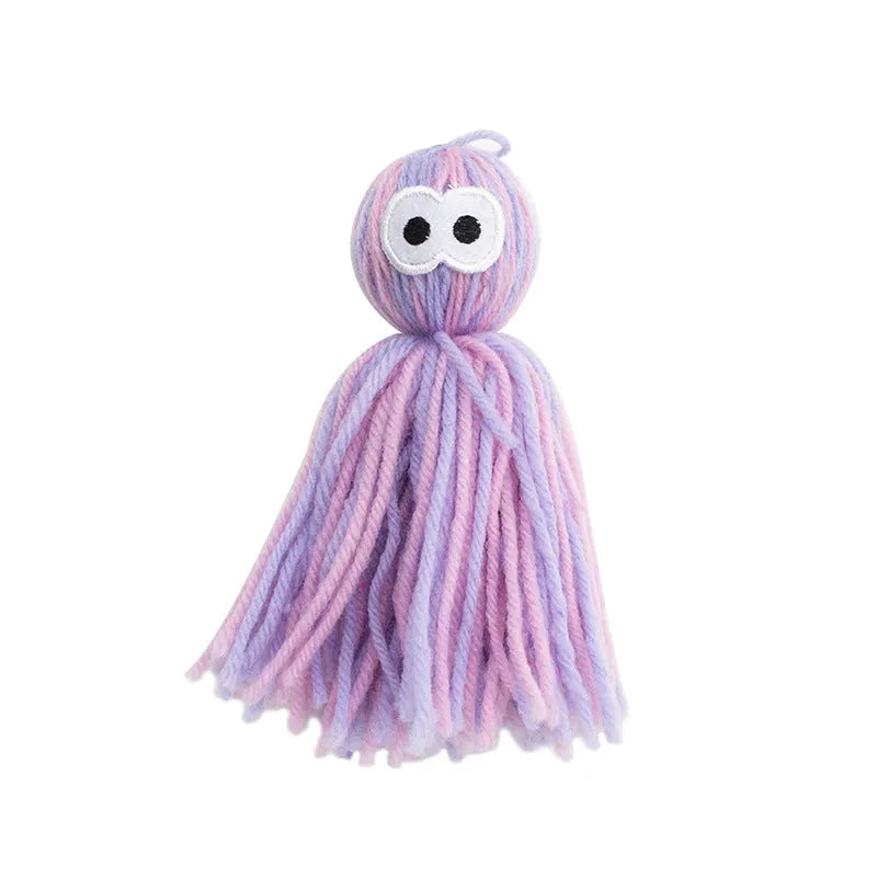 Cat toy wool ball measuring 10x13x4cm with hanging cord and teaser stick attachment in three colour options