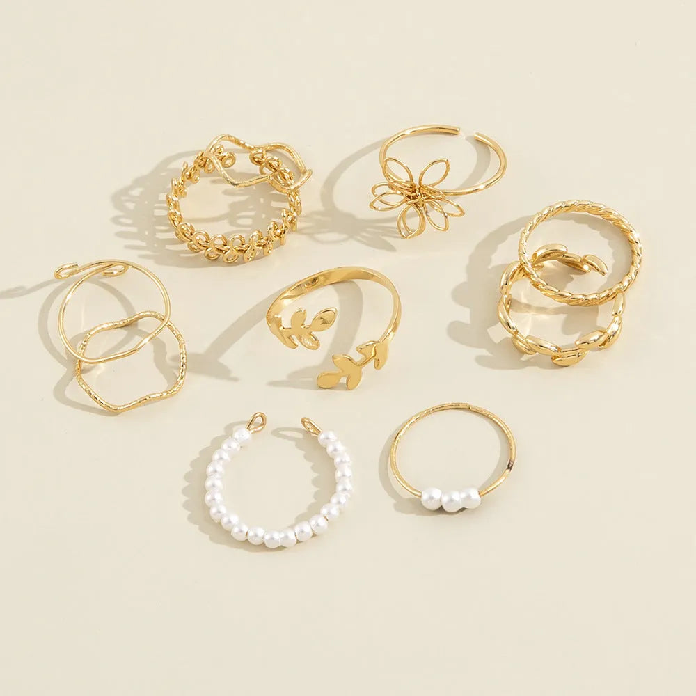 Gold openwork flower ring with delicate floral design and glossy electroplated finish