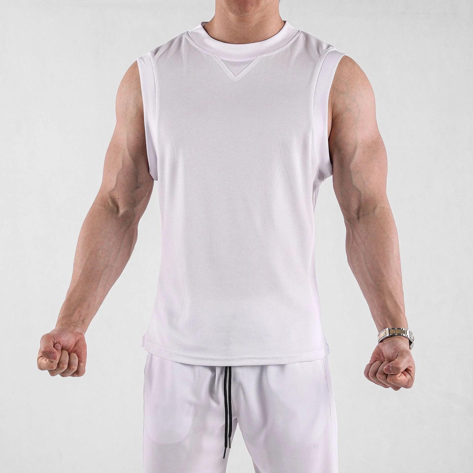 A man's loose-fit black sports vest made from a soft, quick-dry polyester blend fabric.