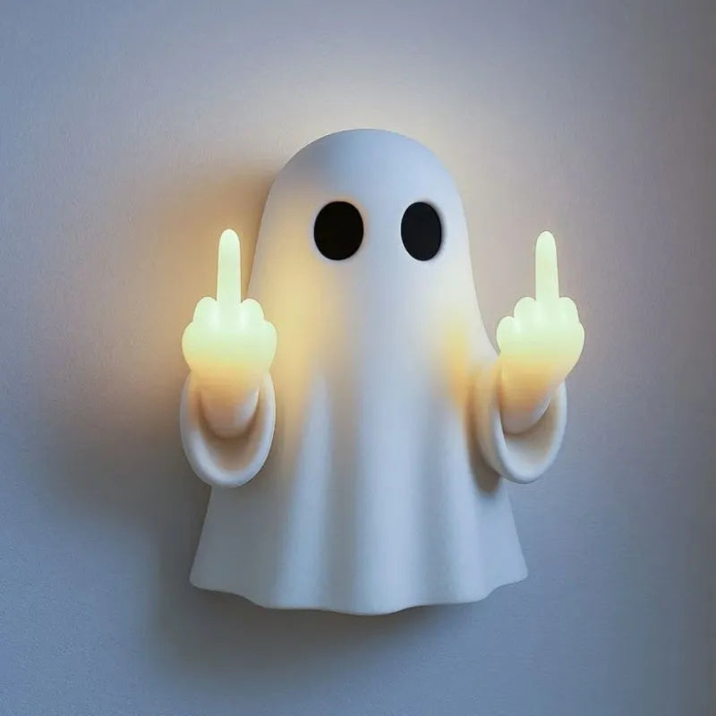 White ghost-shaped night lamp on table with soft glow, measuring 19.85cm tall for Halloween decor