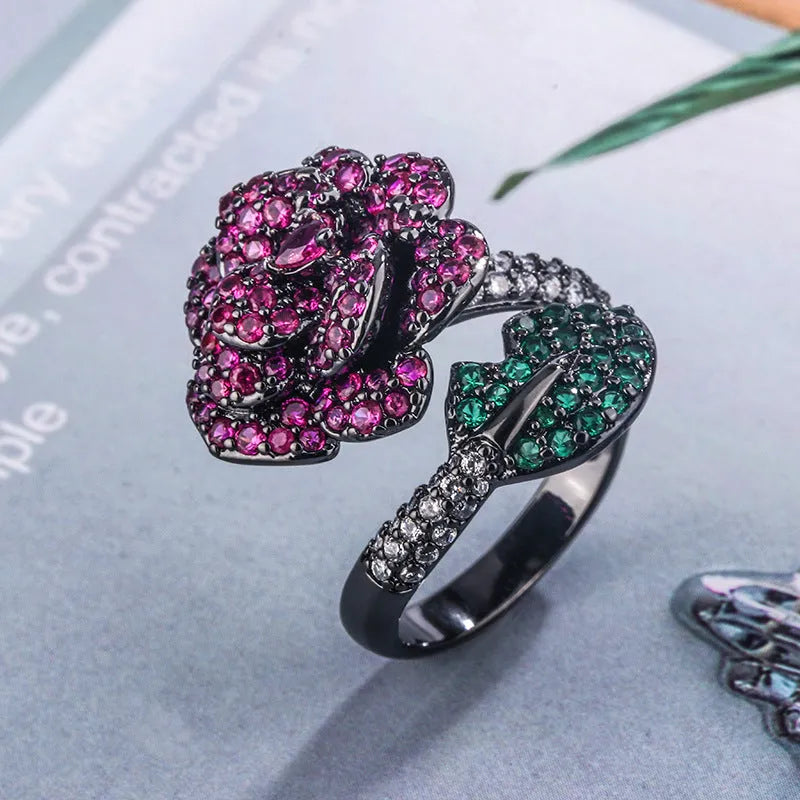Geometric flower ring with black gold plating and red corundum stone