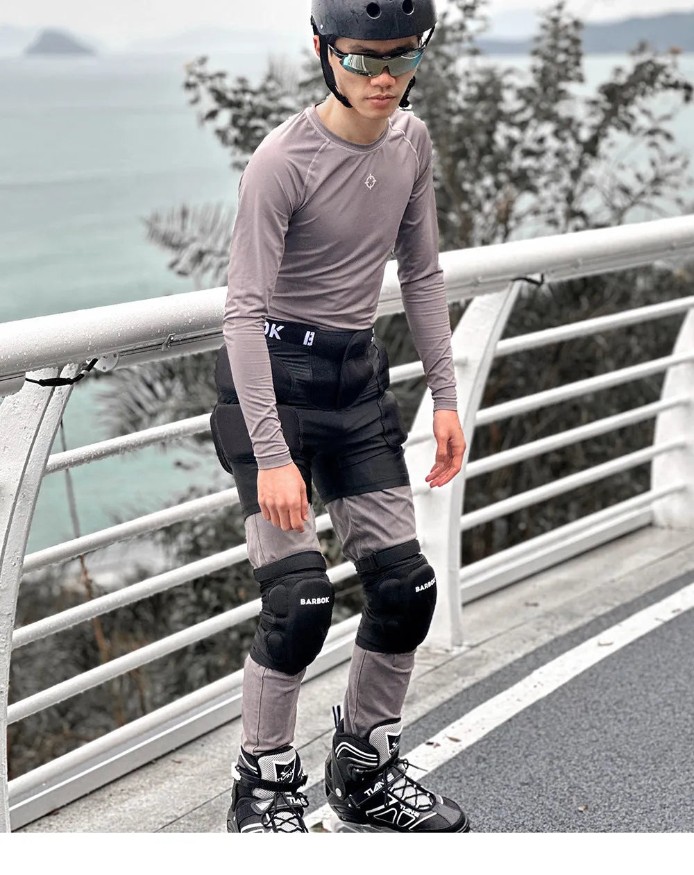 Black skating hip protection pants with integrated NBR foam pads for impact absorption during falls