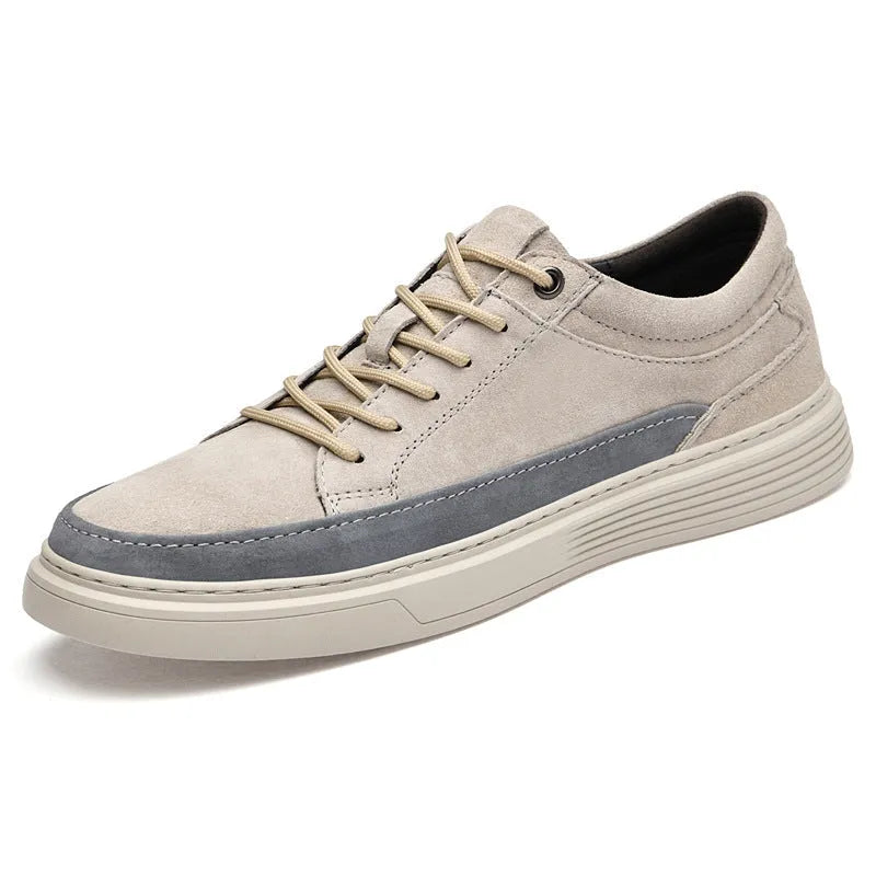 Men's grey casual skate shoes with pigskin upper and rubber sole showing lace-up front and round toe design