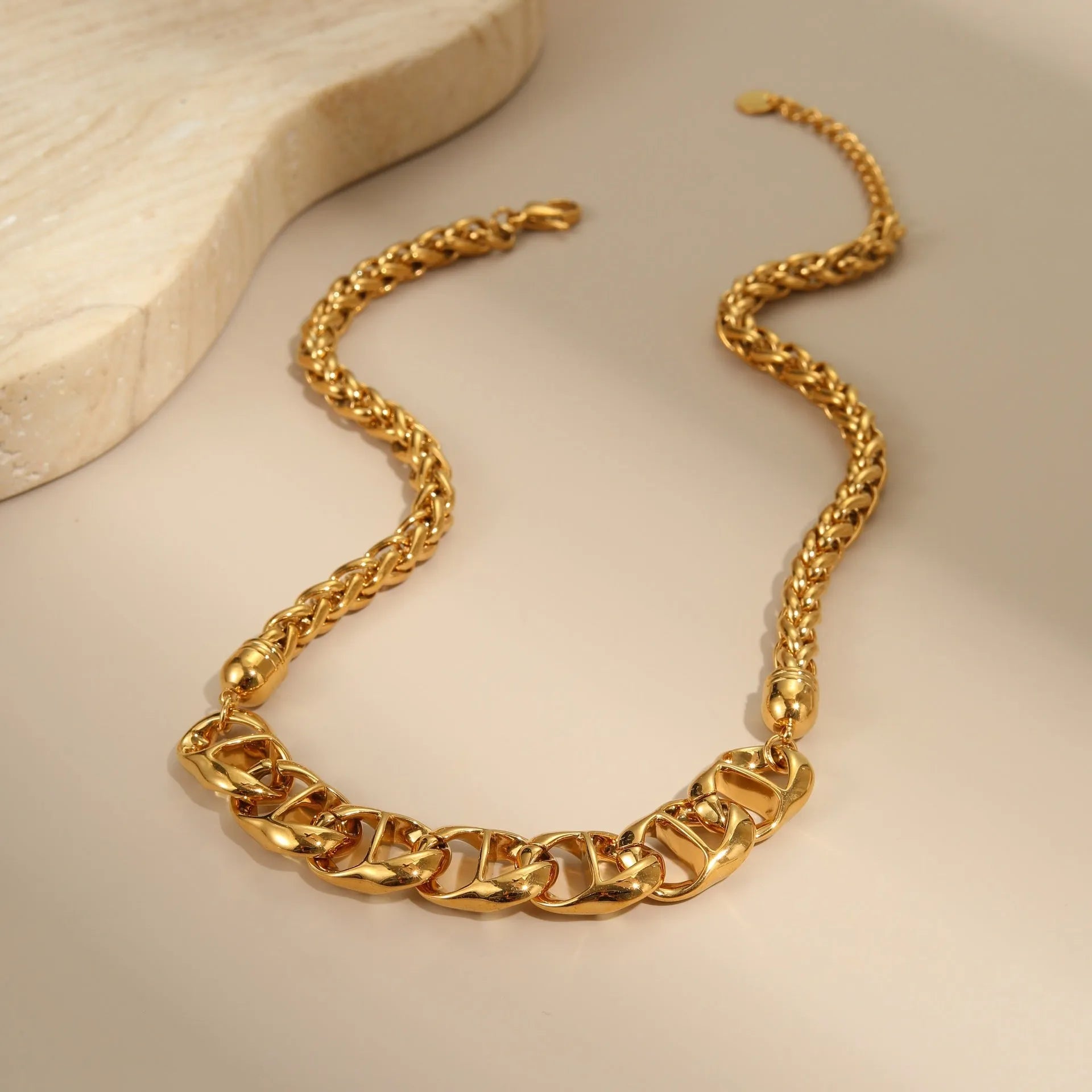 Stainless steel geometric necklace for women, shown in gold-plated and steel finish options.