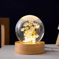 6cm diameter resin crystal ball with preserved dandelion flowers on beech wood stand, USB cable connected