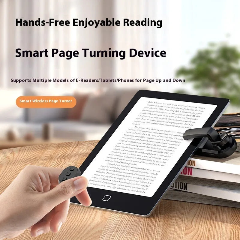 Black wireless page turner remote control and a small clicker on a wooden table.