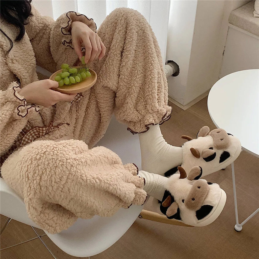 Women's cow slippers with faux fur upper, non-slip PVC sole, and plush lining in white colour