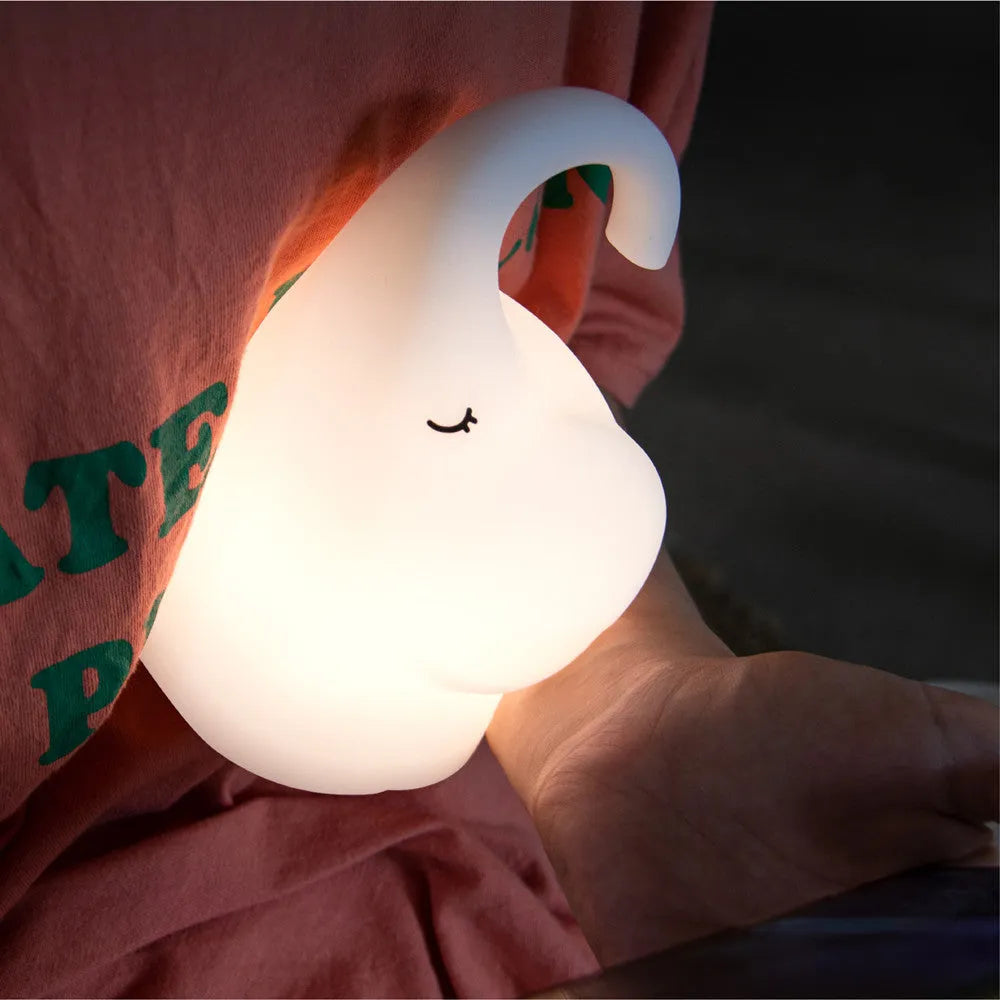Elephant-shaped silicone night light with warm white LED glow, measuring 96mm wide by 151mm high