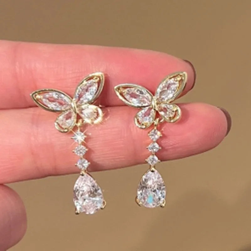 Women's bow-shaped stud earrings with platinum colour electroplated finish on zinc alloy