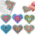 Six PU leather handmade bookmarks with floral cornerite patterns and stick-on crystals for page marking
