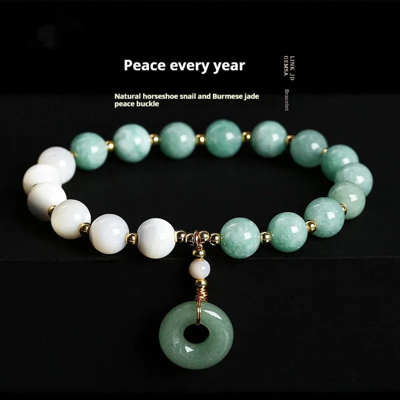 Blue Burma jade bracelet with 8mm round beads and a silver safety buckle clasp.