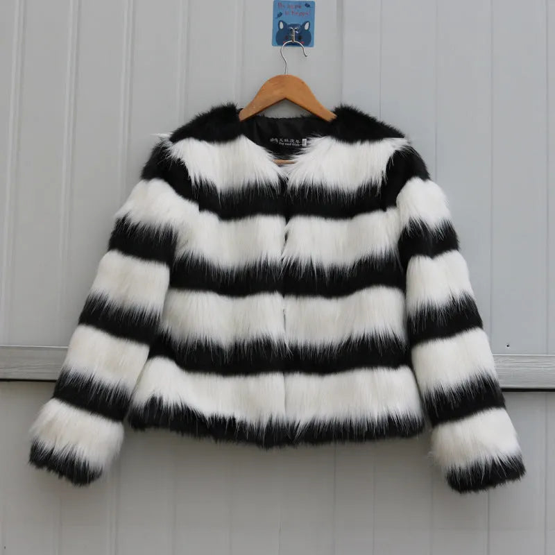 Black and white striped faux fur jacket with long sleeves on female model