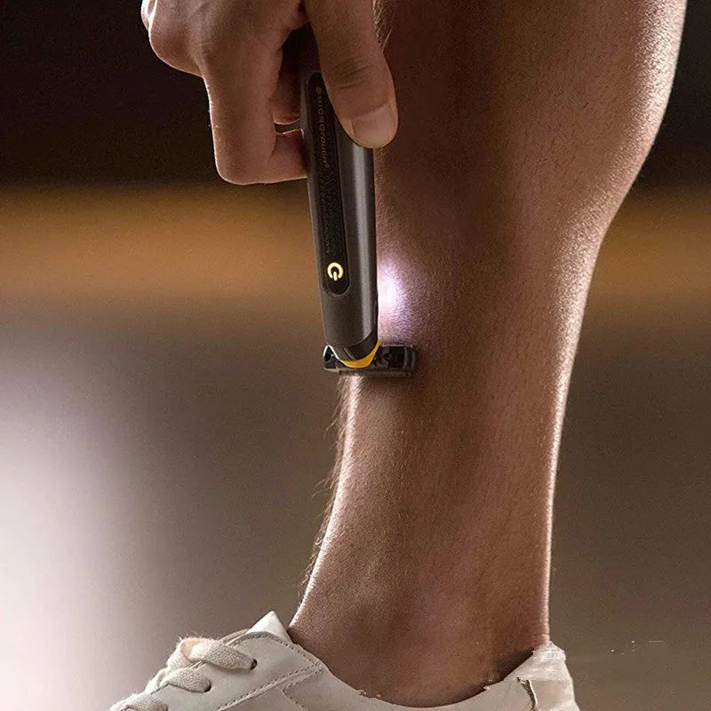 Black wireless rechargeable precision shaver with stainless steel blades, measuring 15cm long with ergonomic handle