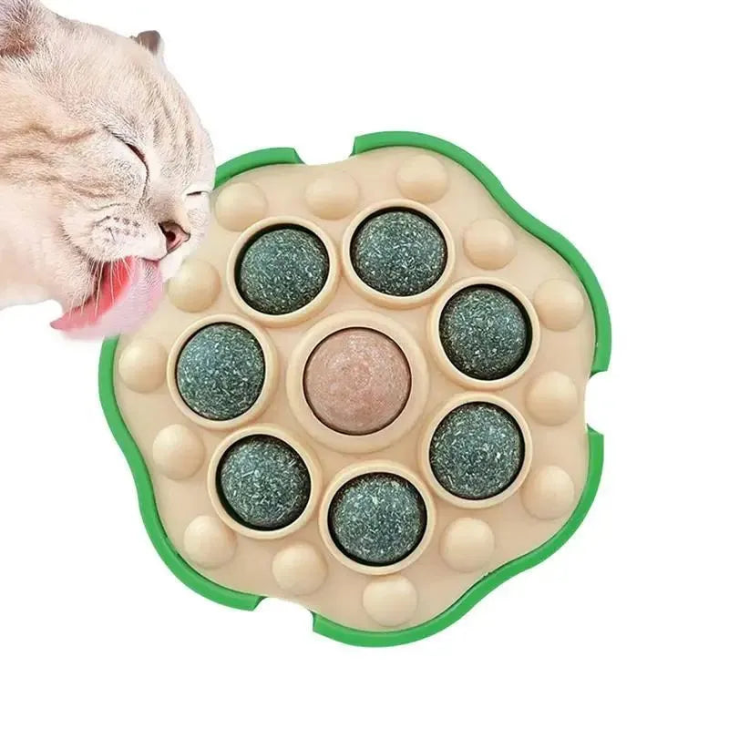 Green lotus-shaped catnip ball with adhesive backing for wall mounting