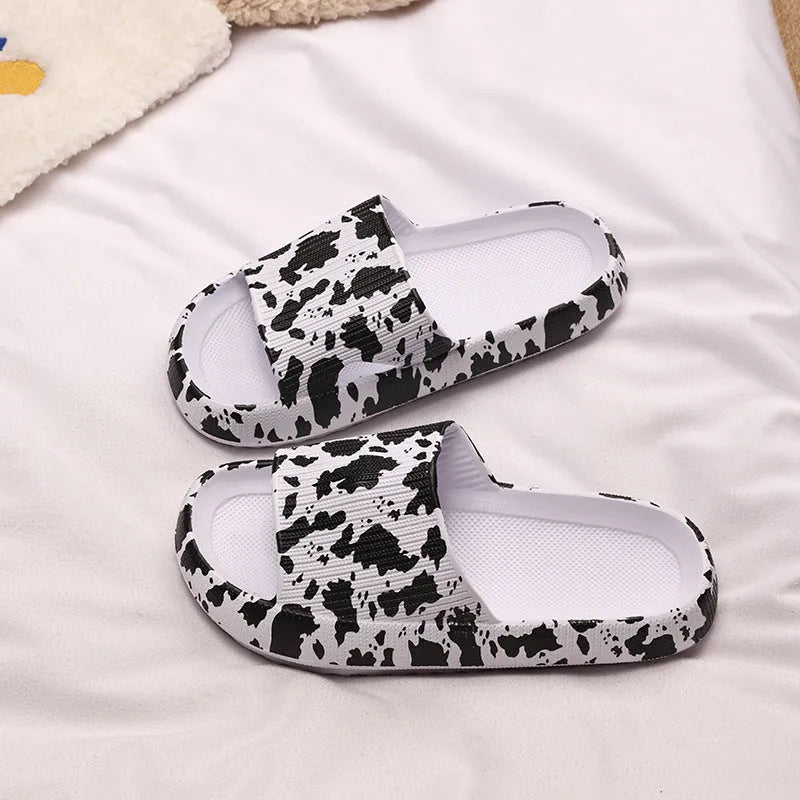 Leopard print slippers with thick EVA sole showing slip-on design and animal pattern details