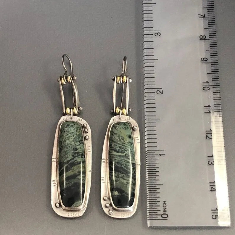 Two-tone geometric marble pattern earrings with alloy construction and post back closure