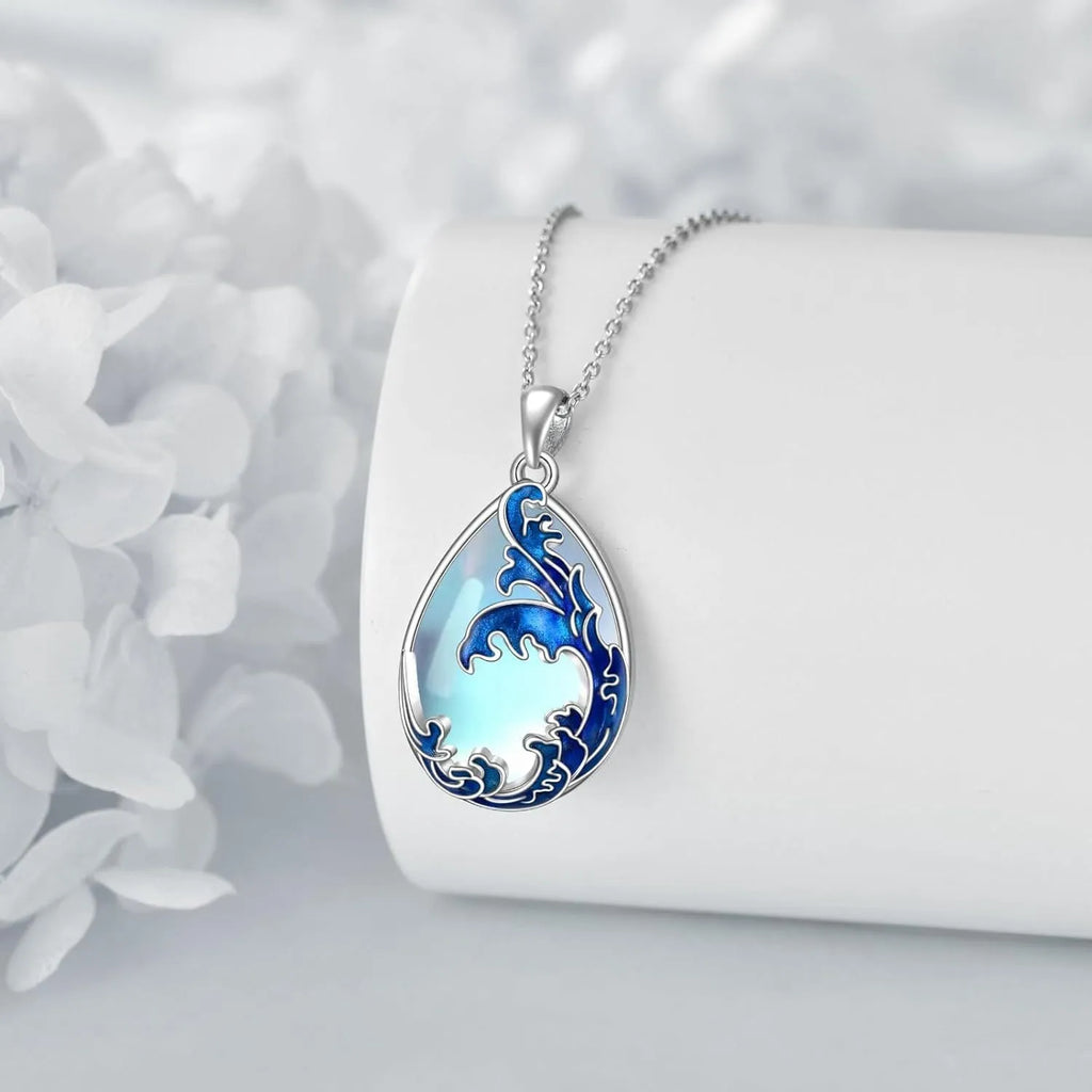 Blue heart-shaped alloy pendant on a necklace chain, love-themed women's jewellery.
