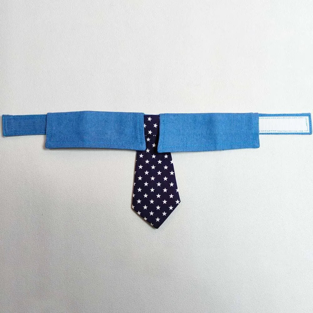 Blue denim dog collar with an adjustable fastener and a choice of bow tie or necktie in a star pattern.