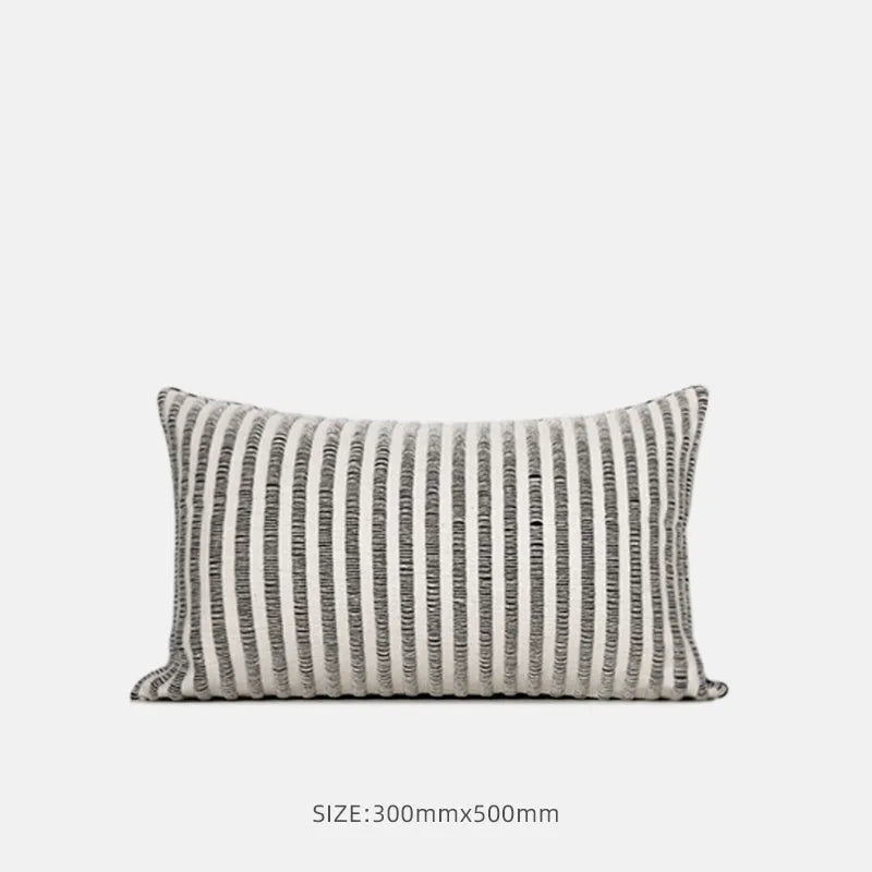 Black and white geometric patterned square and waist living room cushions with towel embroidery.