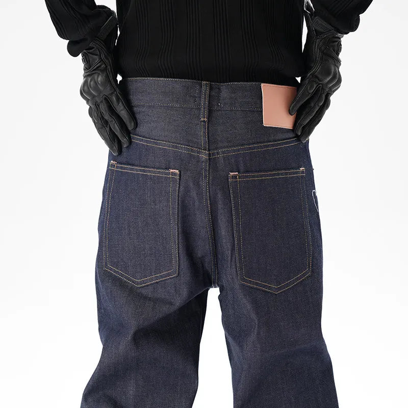 A pair of dark blue loose straight-leg men's jeans on a plain background.