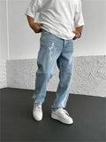 Men's blue straight-leg jeans with a loose wide-leg cut and printed design.