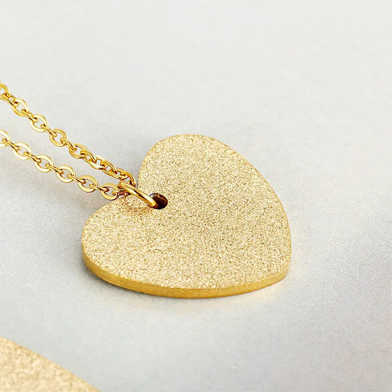 Women's silver titanium steel necklace with a geometric heart pendant