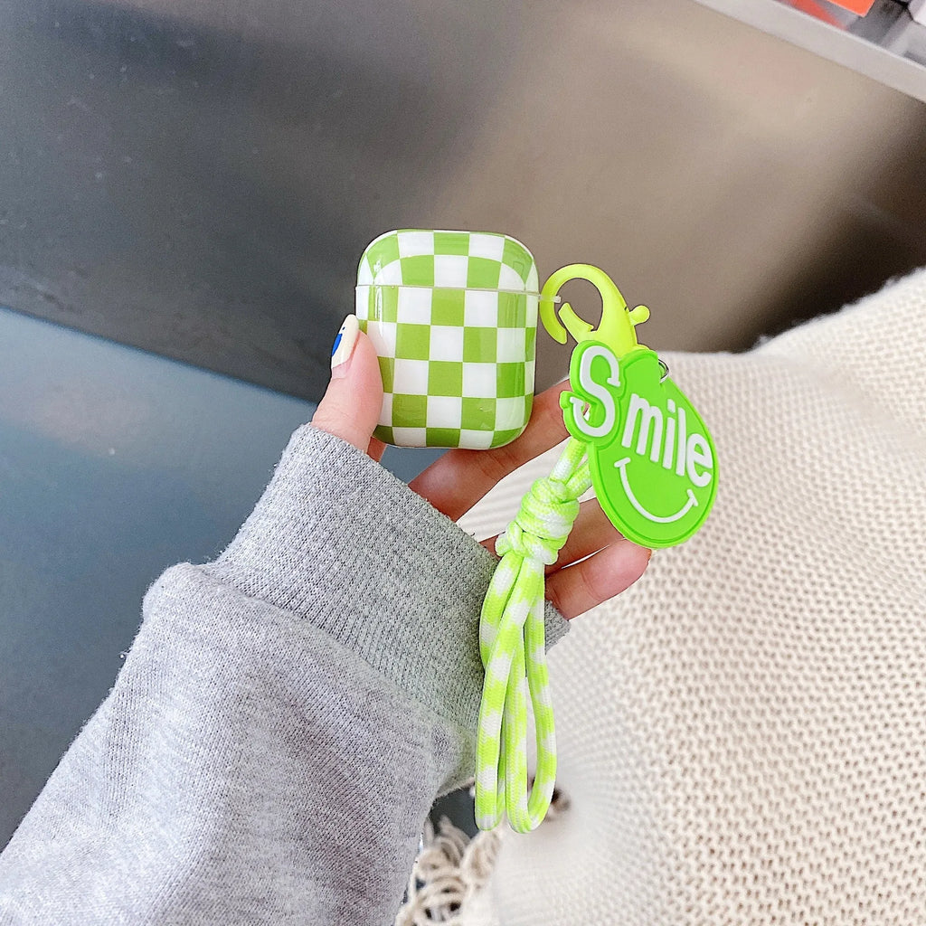 Checkerboard pattern TPU protective case cover for Apple AirPods charging case in black and green.