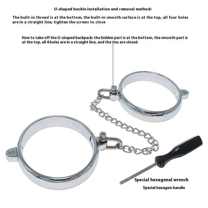 Silver zinc alloy handcuffs and footcuffs set with stainless steel chain linking on black background