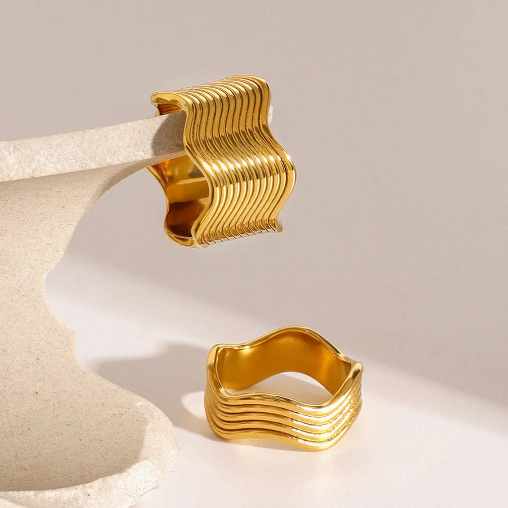 Stainless steel geometric wave pattern ring with 1.2 cm wide surface and electroplated finish