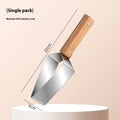 A stainless steel watermelon splitter with triangular blades and a red protective cover on a kitchen worktop.