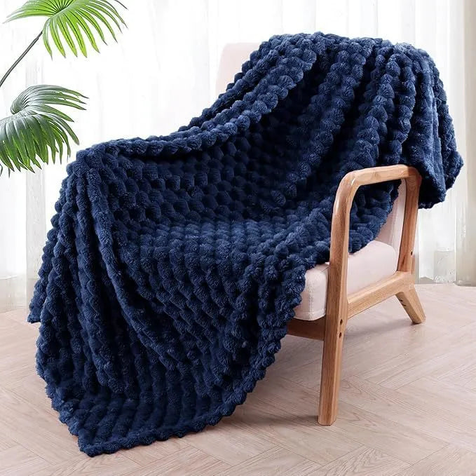 Children's plaid velvet blanket in camel colour, showing soft texture and size scale for cosy use.