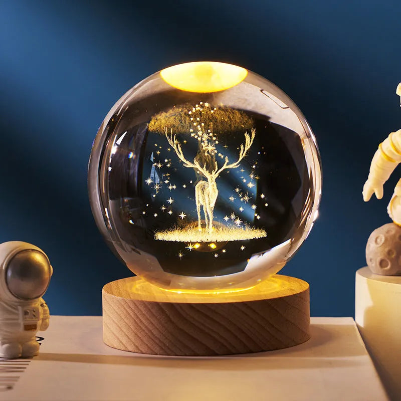 3D crystal ball night light projecting starry sky and planets from its 6cm sphere on a solid wood base.